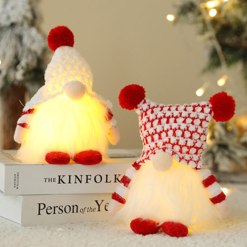 Muñeco navideño sin rostro con luces